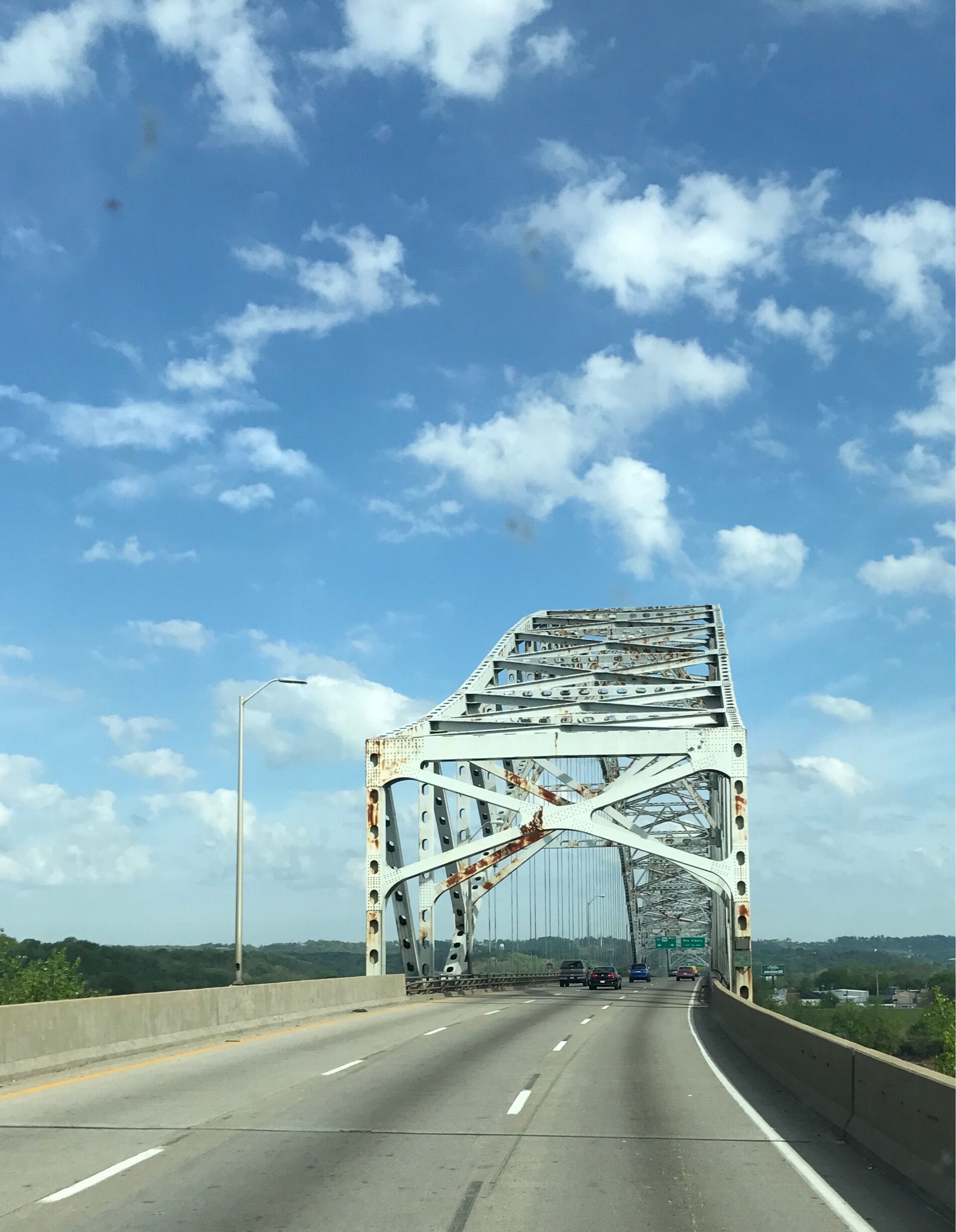 The Sherman Minton Bridge is a double-deck through arch bridge spanning the Ohio River, carrying I-64 and US 150 over the river between Kentucky and Indiana. The bridge connects the west side of Louisville, Kentucky to downtown New Albany, Indiana. 