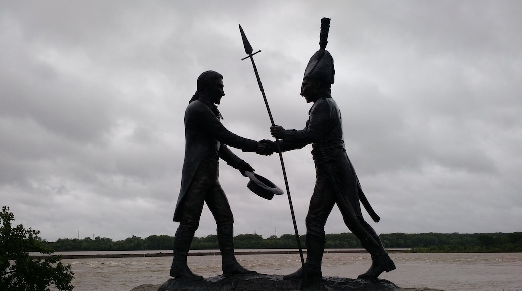 Shilouette of the statue at the entrance to the park on a gloomy day.