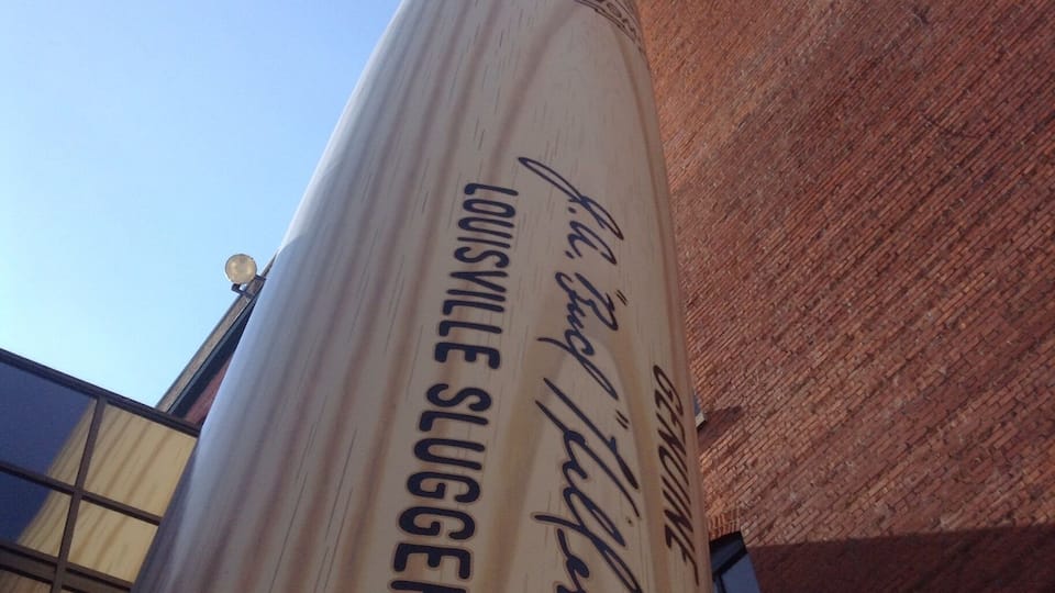 At the Louisville Slugger Museum, this bat towers over the museum and most of the surrounding trees. You can stand under it and it will appear as if it is about to fall top of you.
