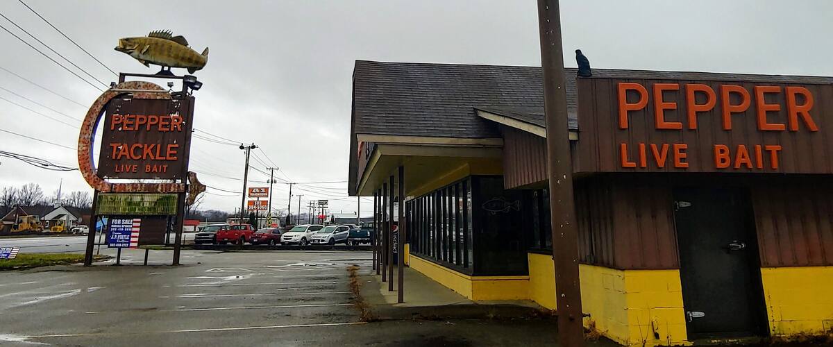 A couple of giant fish remain at a shuttered tackle and bait shop on the outskirts of Louisville.