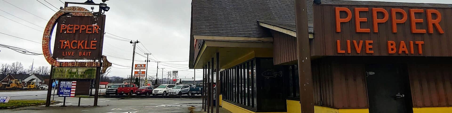 A couple of giant fish remain at a shuttered tackle and bait shop on the outskirts of Louisville.