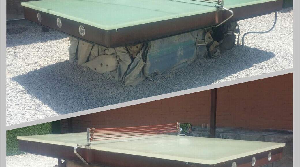 A pair of industrial strength ping pong tables with bases made from compacted cars!