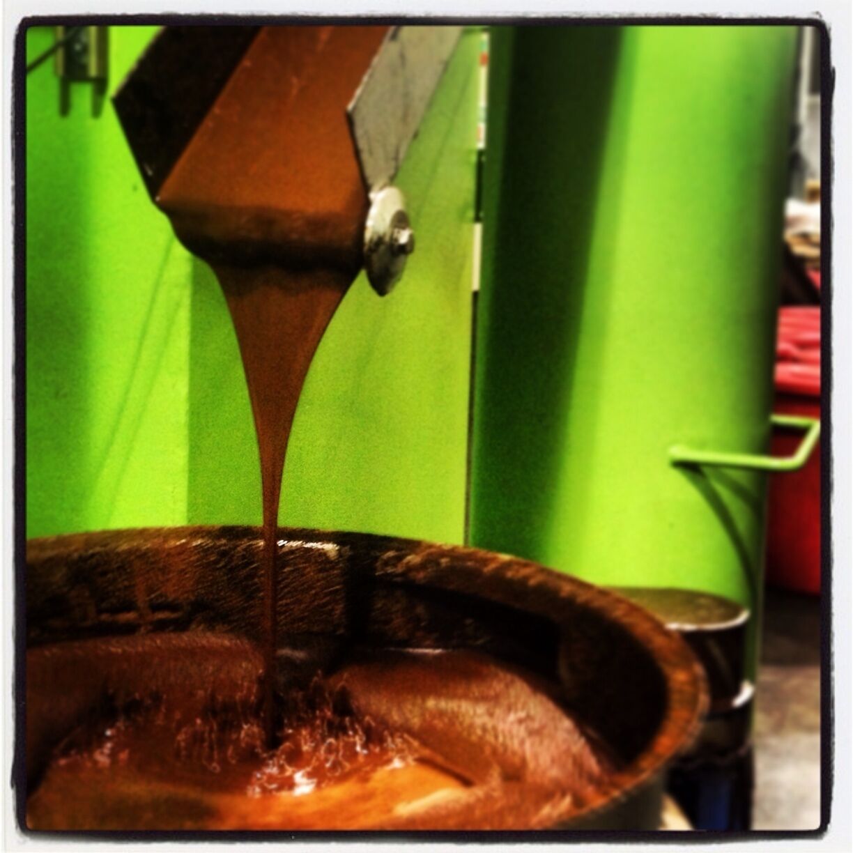 This is the chocolate waterfall. 

It pours hot molten chocolate just inches from the tour, wafting sweet cocoa aromas. 

However, don't indulge in the temptation. This is pure chocolate without any sugar, so it will taste BITTER.