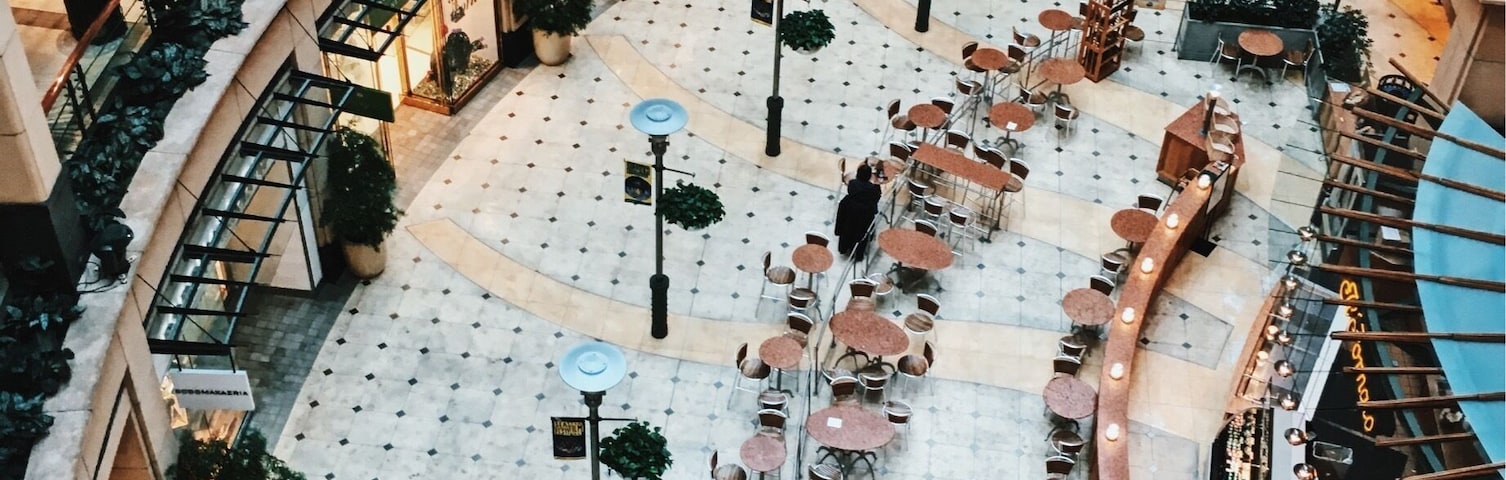 A nice multi-level mall in the middle of the city.