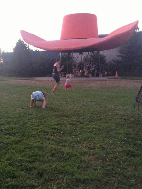 The coolest park ever, with a giant cowboy hat and cowboy boots. (In a former life, they were part of what must have been an awesome gas station.)
These days, the park has a community garden patch and Friday night kid-friendly concerts all summer long. #kidsfun