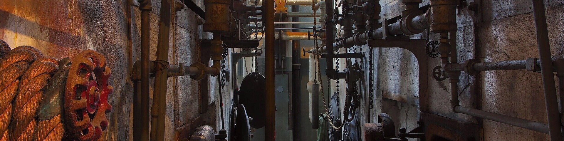 The boiler room at the Steam Plant offers an eerie glimpse into early 20th-century working conditions.  Oil (and later coal) was fed into 16 giant boilers to produce the steam required to turn the Curtis Steam Turbines in the room next door.
The Georgetown Steam Plant was built in 1906 to provide power for Seattle's streetcars, the city of Georgetown, and the Seattle-Tacoma Railway.  Although the turbines were state-of-the art for their time, the technology was advancing so quickly that the plant became outdated within 10 years. It was soon relegated to secondary status and was used occasionally through the 1970s during droughts and to meet peak power demand.
Today, the nearly-complete plant is operated as a free museum and is open to the public the second Saturday of every month from 10am-2pm.