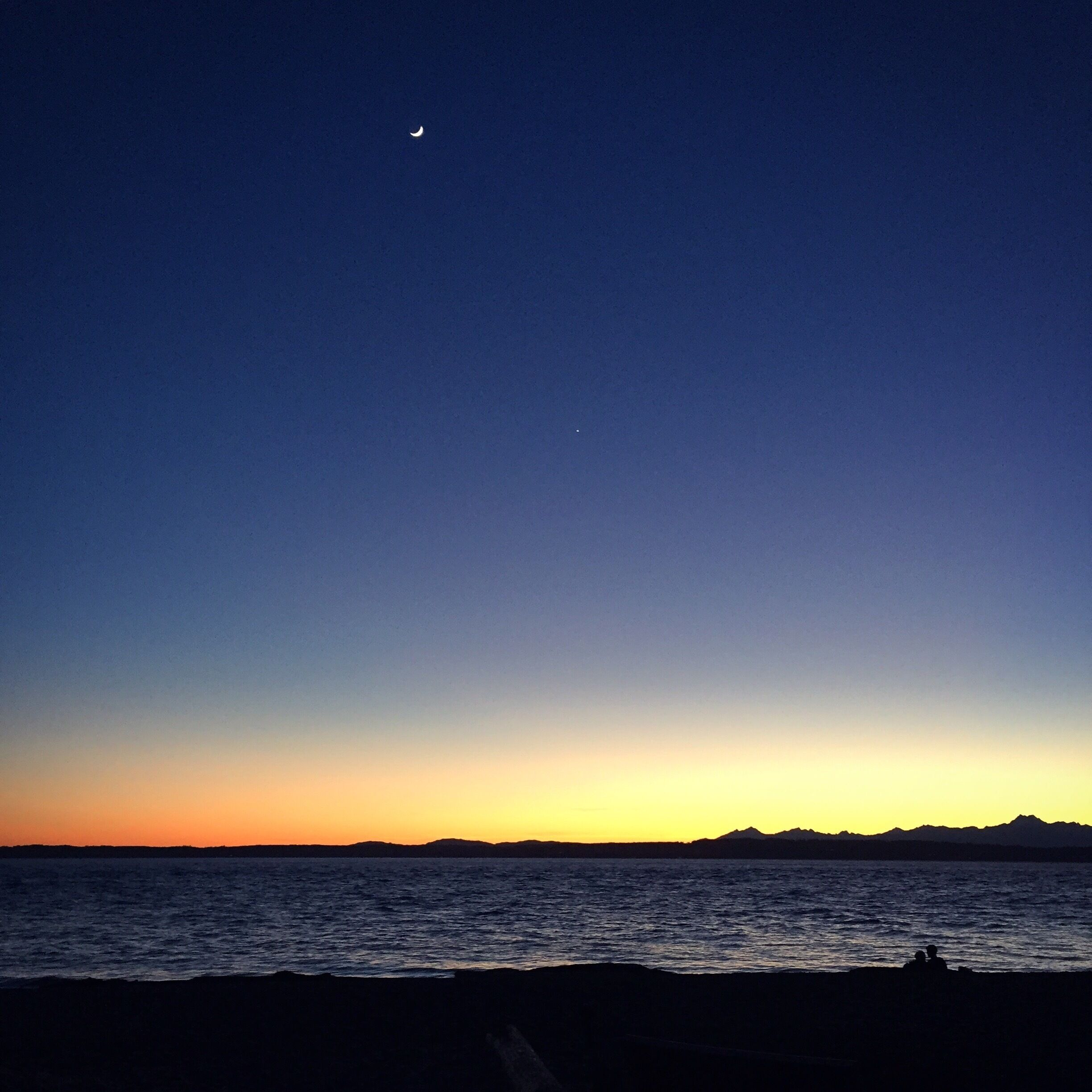 Best place in Seattle to catch the sun setting over the Olympic mountains. Skip past the crowds and barbecues at the south end of the park and walk along the beach to the much quieter north end of the park for killer views, illegal fire pits, and romantic spots to watch the sunset. #blue