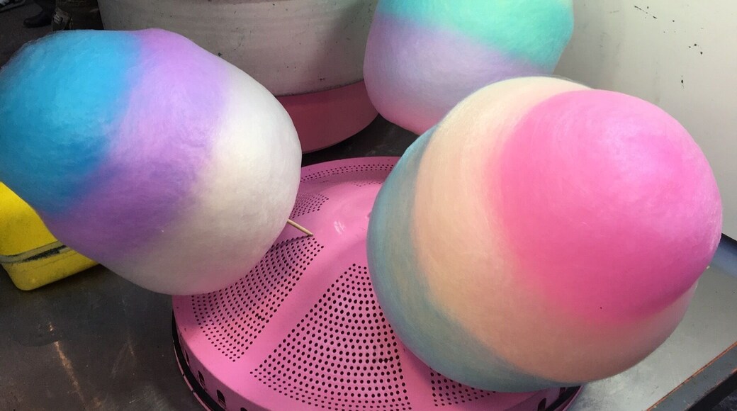 These colorful cotton candy are also shaped into flowers !! Street side carts.