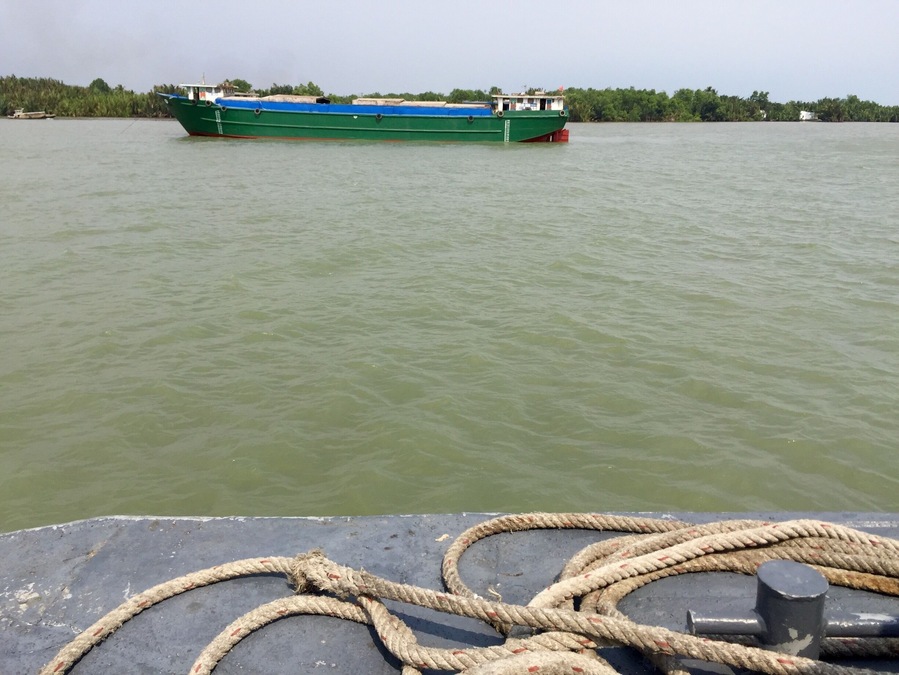 Riding the Petro Express on the Sông Lòng Tàu, Cần Giờ, Hồ Chí Minh, Vietnam. The banks are thick with foliage. Amazing to see this watery interstate of boats.