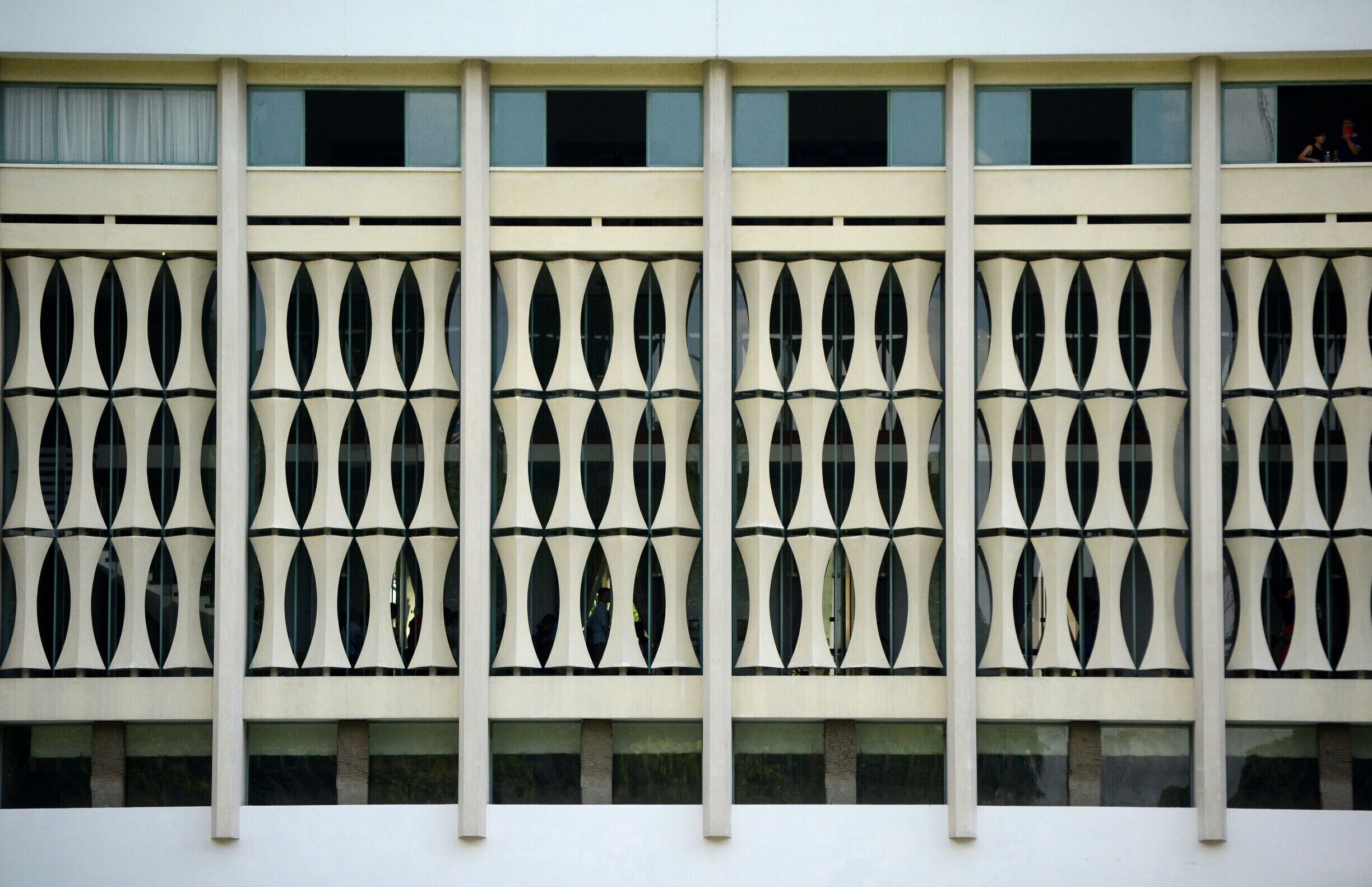 When I imagined Independence Palace, I pictured something more fitting of the rich history of Vietnam. To say that this Mid-Century Modern facade surprised me, would be an understatement. Though not what I expected, I find it's symmetry and simple geometric pattern beautiful in their own way.

#Asia #Vietnam #Geometry #Pattern