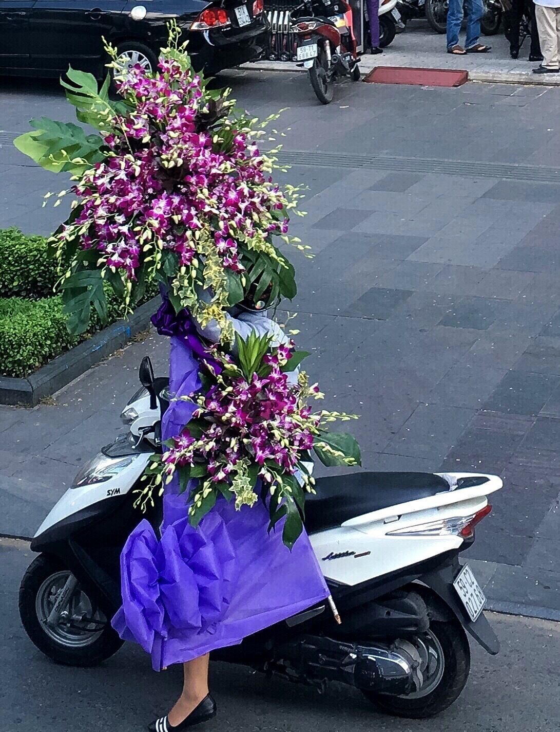 One of the distinctive things about Saigon is the number of motorcycles and the way people carry anything and everything on them.  I thought this was particularly lovely example.