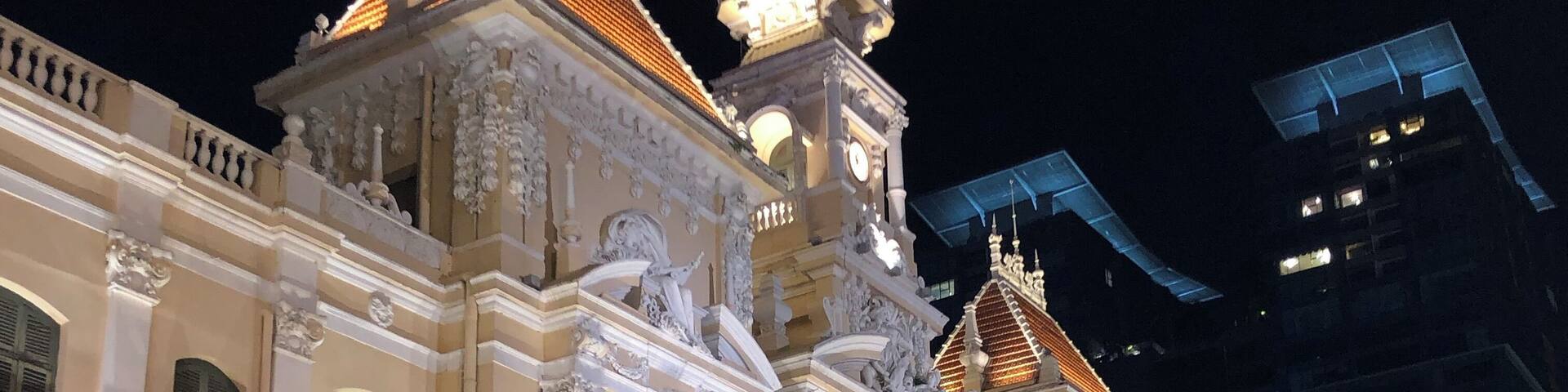 The City Hall in Ho Chi Minh lit up at night.