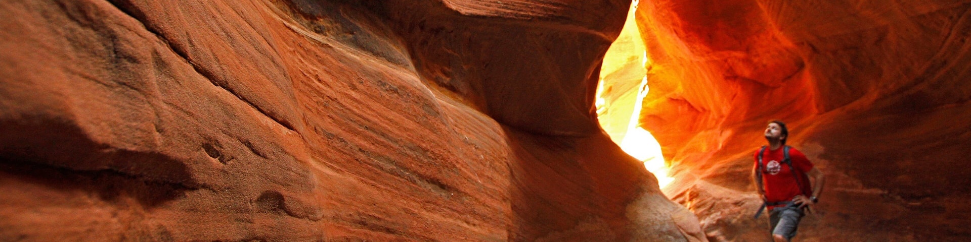 St. George showing climbing and a gorge or canyon as well as an individual male