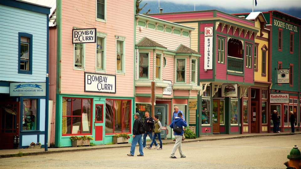 Colorful buildings with signs for Bombay Curry, Radio Shack, and Bicycles.
