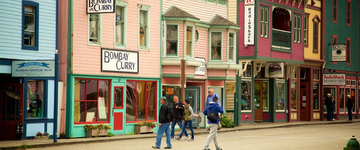 Colorful buildings with signs for Bombay Curry, Radio Shack, and Bicycles.