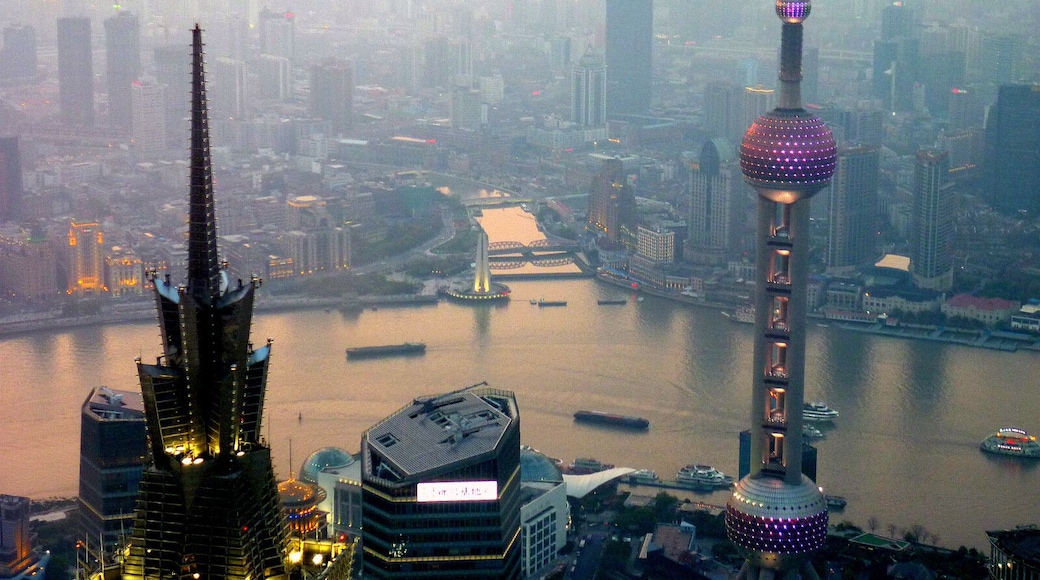 #LifeAtExpediaGroup Shanghai spread out below as the sun sets. Always an amazing feeling looking down on such massive buildings, while also being looked down on by the massive Shanghai tower behind.