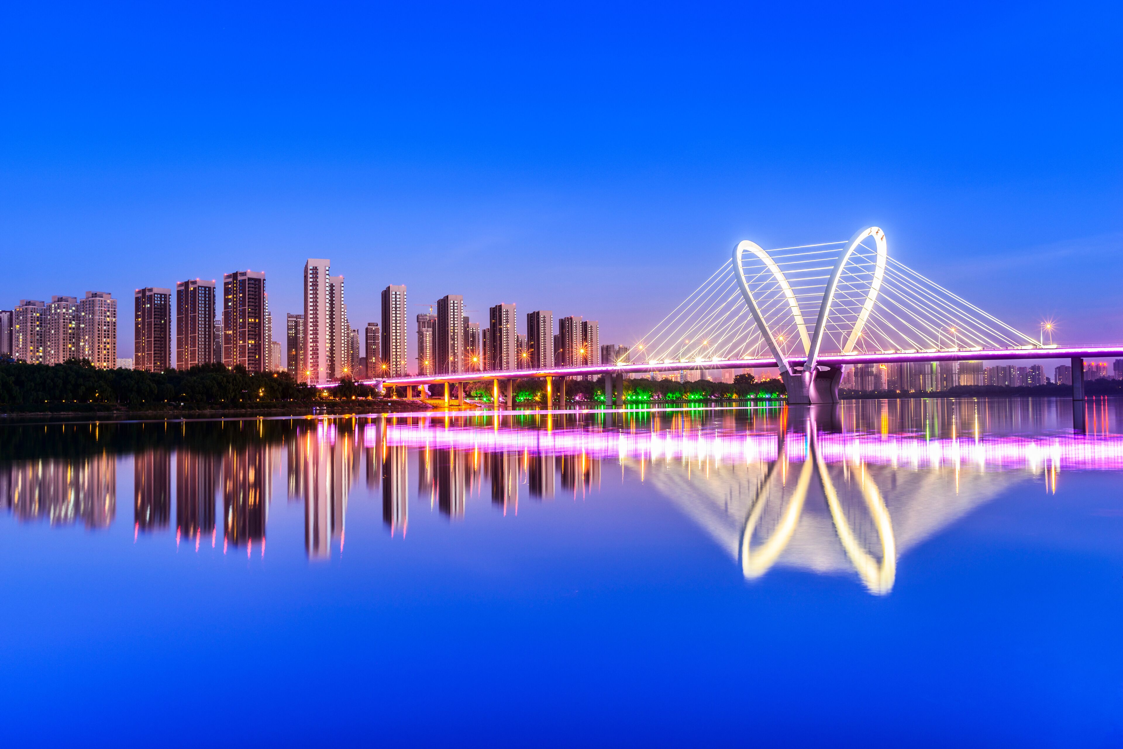 Modern bridge  and skyscraper at dusk. Located in Shenyang, Liaoning, China.