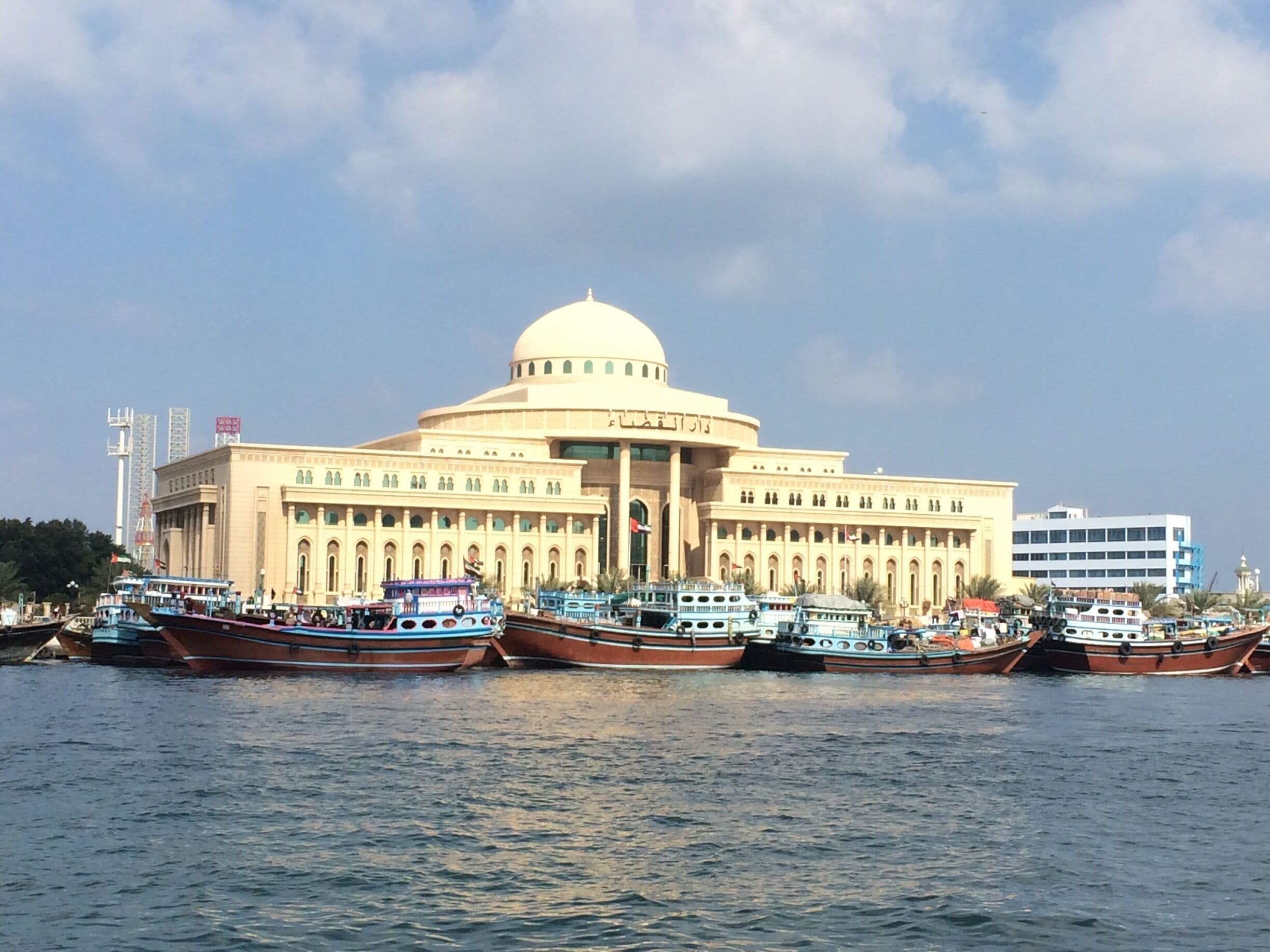 Bus 306 from Ghubeiba Station in Dubai. Takes about 35 minutes.