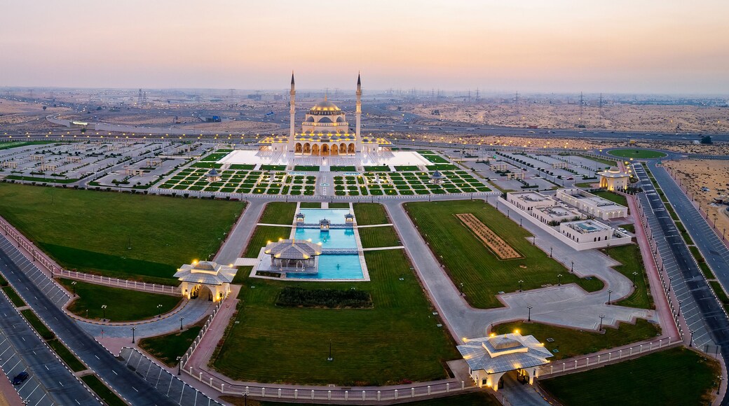 Aerial View of Sharjah Mosque at Sunset Showcasing Symmetrical Islamic Architecture