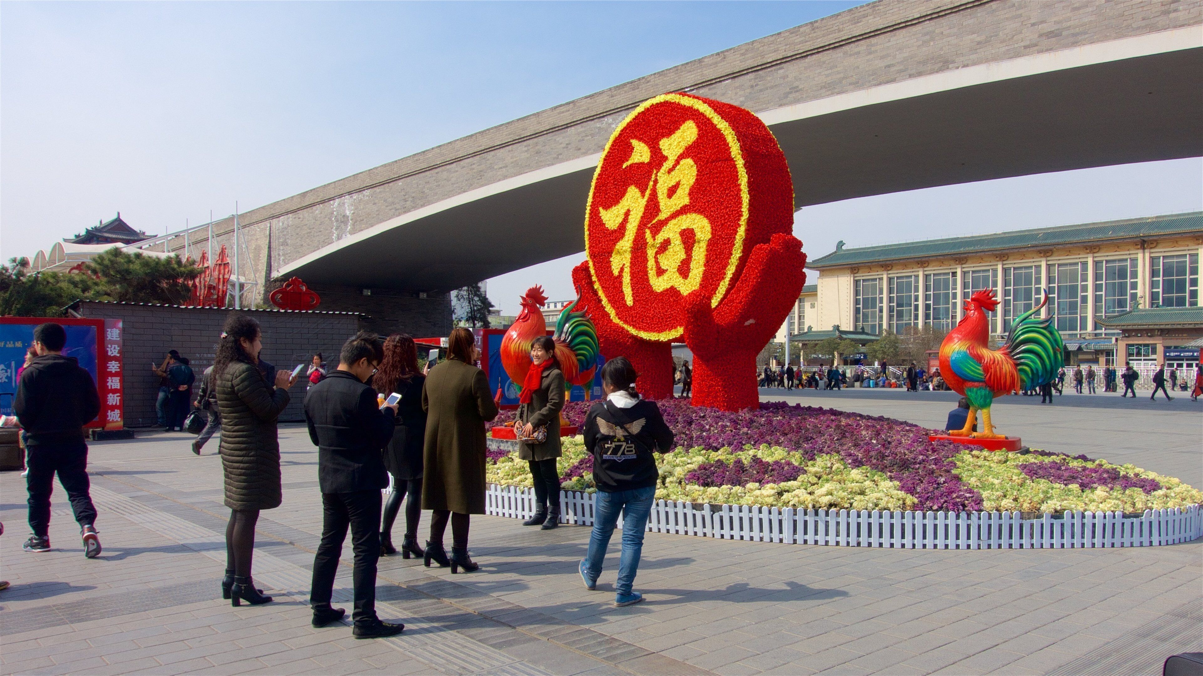 Xi\'an featuring a square or plaza, flowers and a bridge