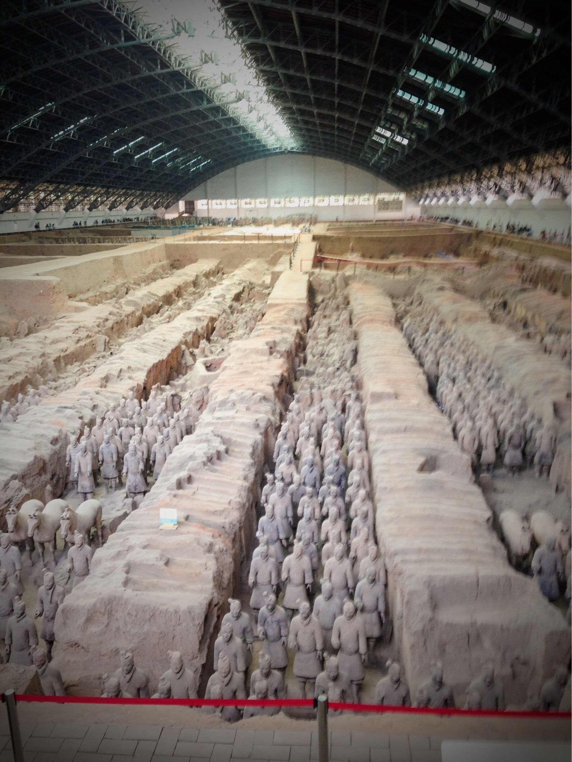 The army was made to guard the mausoleum of the First Emperor of China, Qin Shi Huang, who lived more than 2200 years ago.  It is part of Qin Shi Huang’s tomb; it is located about 1.5 kilometers east of the Emperor QinShihuang’s mausoleum.  

The complete army was painted but on exposure to sun the paint quickly bled away.  The majority of the army remains buried until they can discover a means to recover them in their original state.

The Terracotta Army was discovered by local farmers in 1974 at Xian, in China, when they were digging a well.  While most fled believing they'd discovered a dead body, one remained to unearth the discovery and is solely credited for the discovery.

#InStone