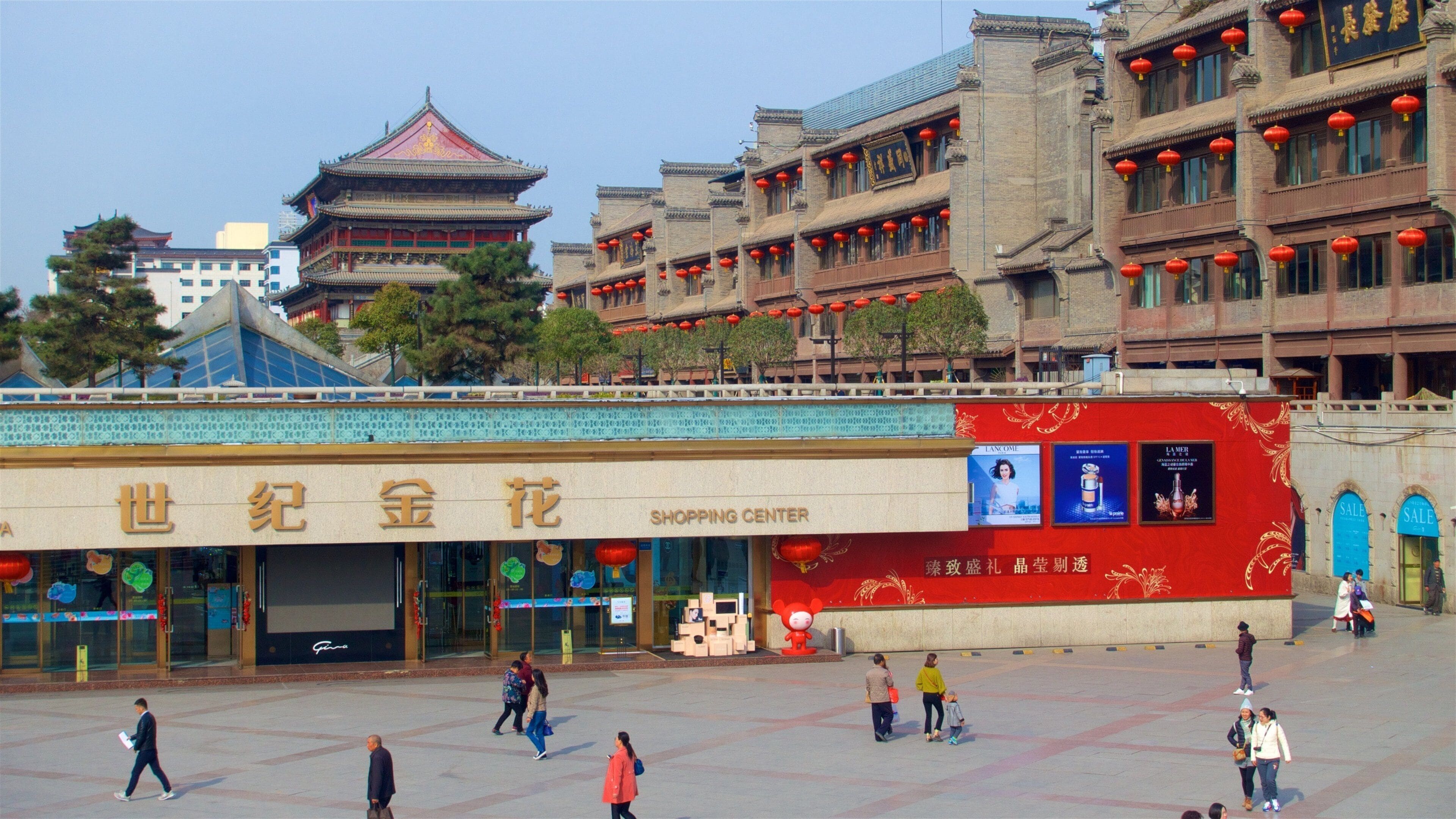 Xi\'an featuring a city and a square or plaza as well as a small group of people