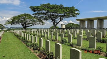 This is well worth the visit and is so well maintained. Kranji War Cemetery is 22 kilometres north of the city of Singapore, on the north side of Singapore Island overlooking the Straits of Johore. It is located just to the West of the Singapore-Johore road (Bukit Timah Expressway) on Woodlands Road, just to the south of the crossroads with Turf Club Avenue and Kranji Road. There is a short approach road from the main road. The Cemetery is known locally as Kranji Memorial and one must be sure of the address before boarding a taxi as most taxi drivers do not know the Cemetery. There are also bus stops on the main road facing the Cemetery. The Kranji MRT