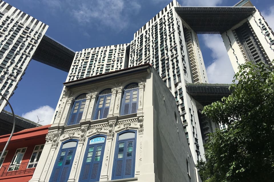A modern building with a unique architectural design, featuring a mix of traditional and contemporary elements.