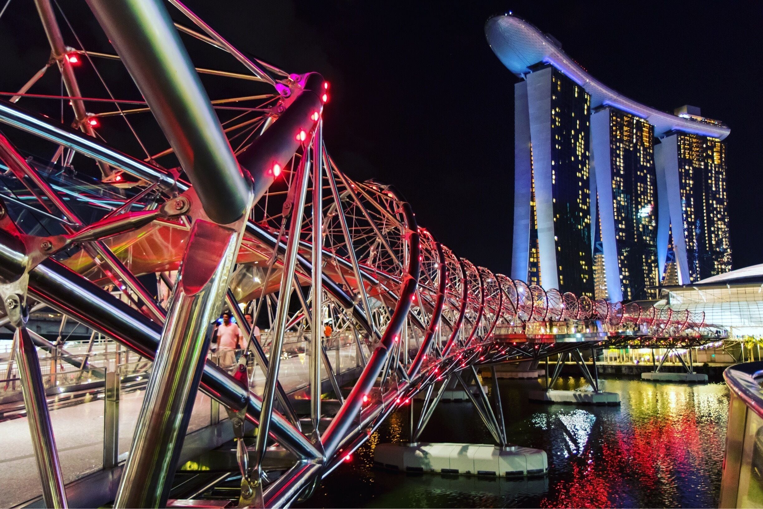 Best shot at night when all the lights are on around the marina. Be patient as it’s busy with pedestrian tourists 