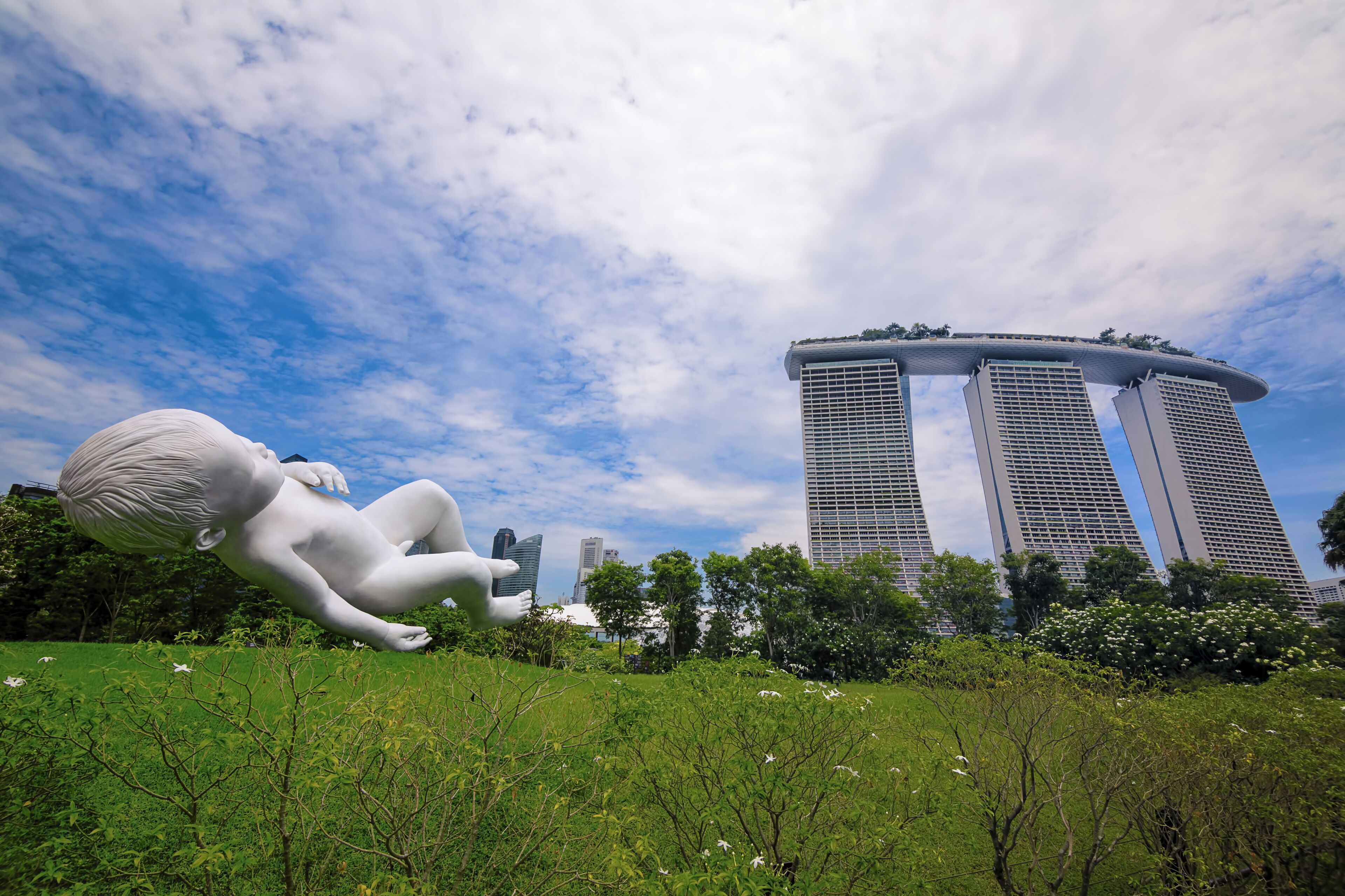 PLANET
by Marc Quinn

Bronze stainless steel statue of a floating, sleeping boy above a verdant earth displayed on the southern area of Gardens by the Bay.