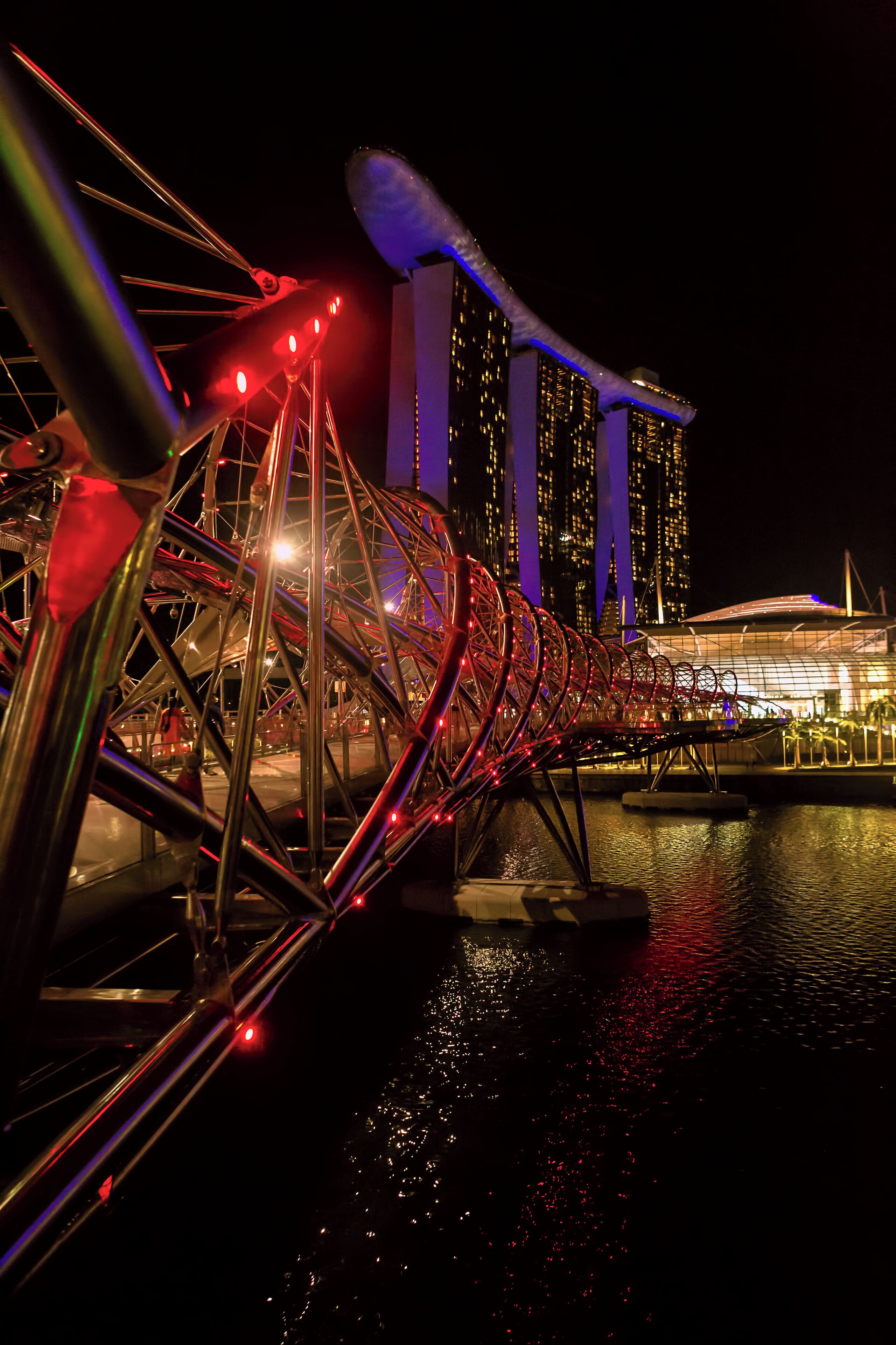 The Helix Bridge, one of many architectural marvels in the city of Singapore, looks even more spectacular at night.