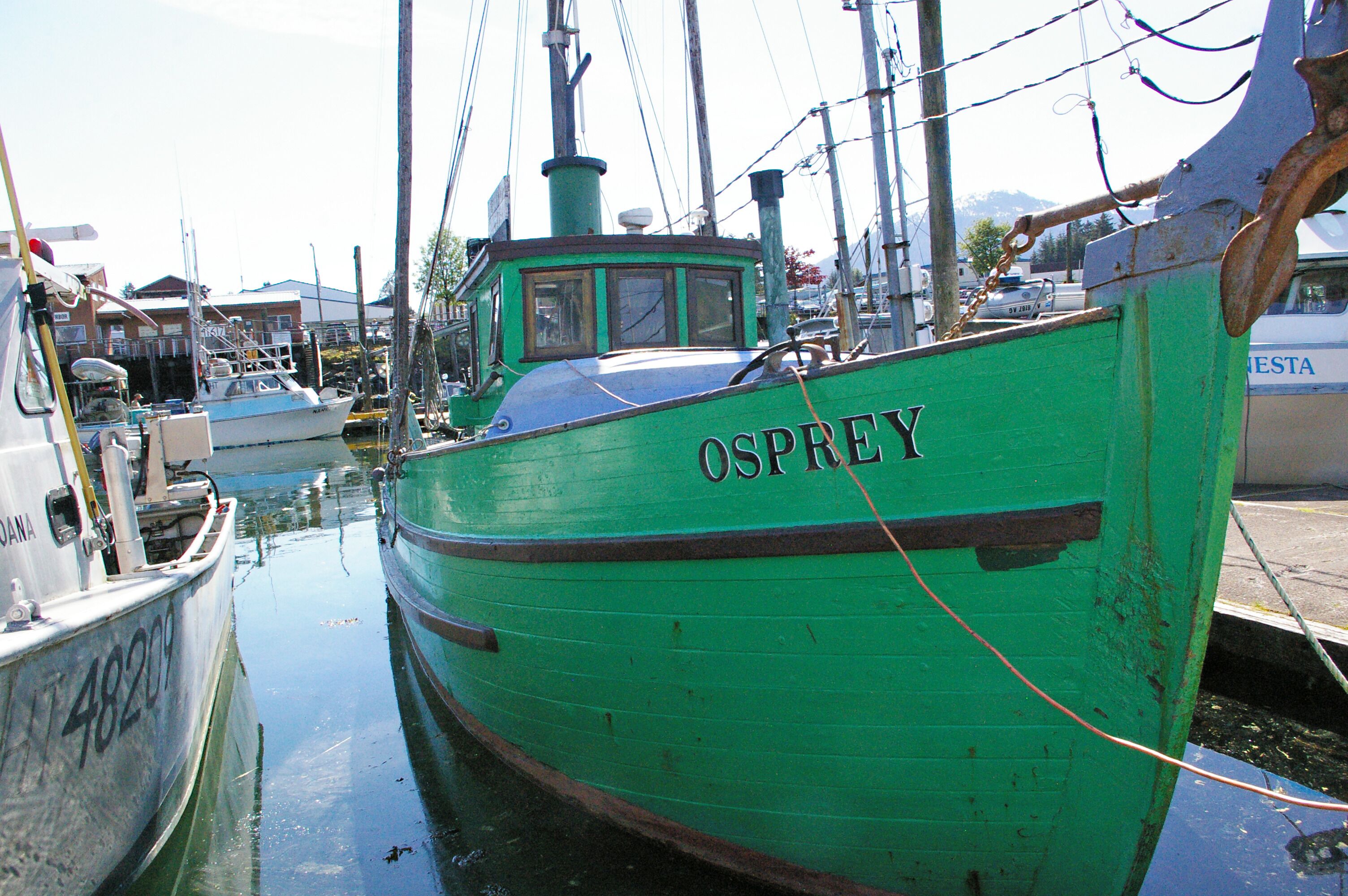 Fishing boat at the dock.  I really like the bright green paint job on the hull and cabin.