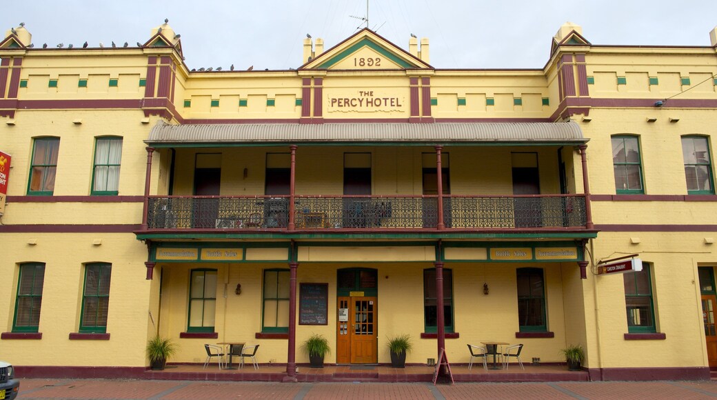 Singleton featuring signage, heritage architecture and a hotel