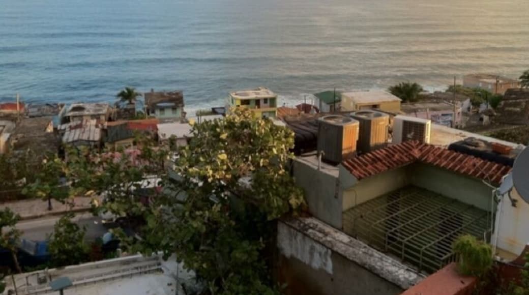 View of the ocean & the colorful La Perla slum in Old San Juan. The irony that such a lovely oceanfront location is home to crime and poverty boggles my mind.