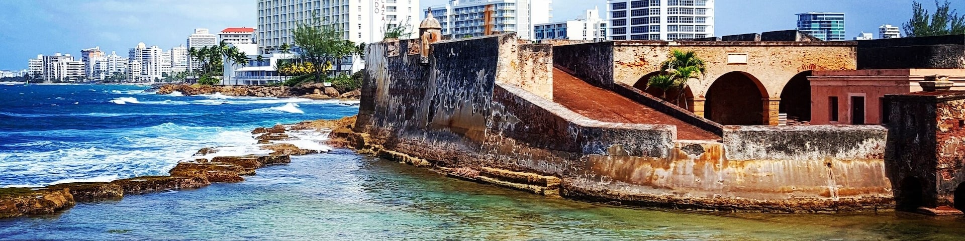 The Caribe Hilton is one of my all time favorite hotels - and not just because of this old-meets-new view!