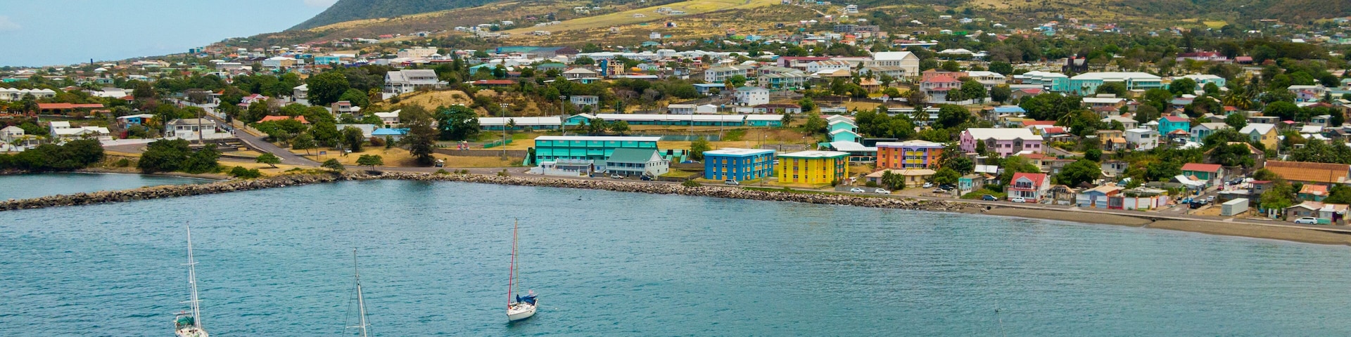 Basseterre showing landscape views, a sunset and a coastal town