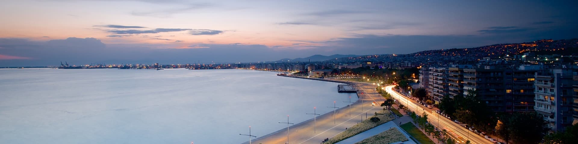 Thessaloniki showing a city, a sunset and general coastal views