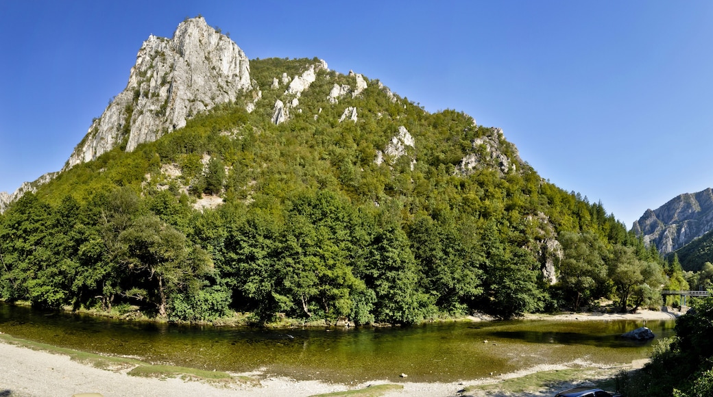 Panoramic view of Treska River flowing through the overgrown rocky hills of Matka Canyon. A popular tourist attraction in Skopje, Macedonia.