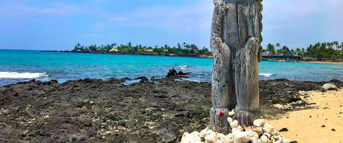 A weathered statue of the Hawaii god Ku. 
Ku is the god of war and prosperity.