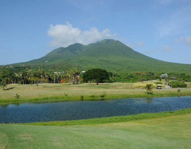 Nevis is the quintessential volcanic island paradise with its conical shaped peak that is normally obscured by cloud cover.

This was actually the view from our room and we had a rare clear day and the top was visible for a few hours.

The volcano was actually named by Christopher Columbus when he discovered the island in 1493. Thinking the white stuff on top of the volcano was snow he called it Nuestra Señora de Nieves. Nieve means snow in Spanish... it later morphed from Nieves to Nevis.

A very quite sleepy island that is great if you want to escape it all big time. It is truly one of the nicest islands in the Caribbean.