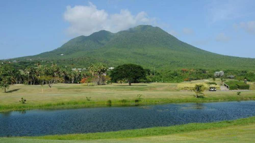 Nevis is the quintessential volcanic island paradise with its conical shaped peak that is normally obscured by cloud cover.
This was actually the view from our room and we had a rare clear day and the top was visible for a few hours.
The volcano was actually named by Christopher Columbus when he discovered the island in 1493. Thinking the white stuff on top of the volcano was snow he called it Nuestra Señora de Nieves. Nieve means snow in Spanish... it later morphed from Nieves to Nevis.
A very quite sleepy island that is great if you want to escape it all big time. It is truly one of the nicest islands in the Caribbean.