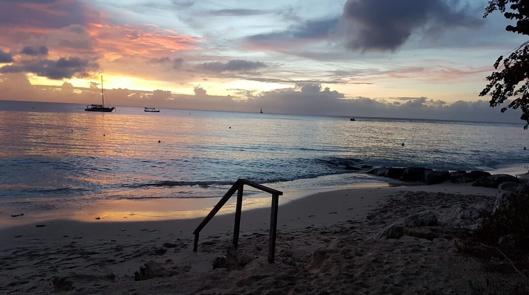 Enjoy a cocktail or two as you watch the sunset on Barbados' stunning white sand beaches of the Platinum Coast #LifeAtExpedia #BeachTips