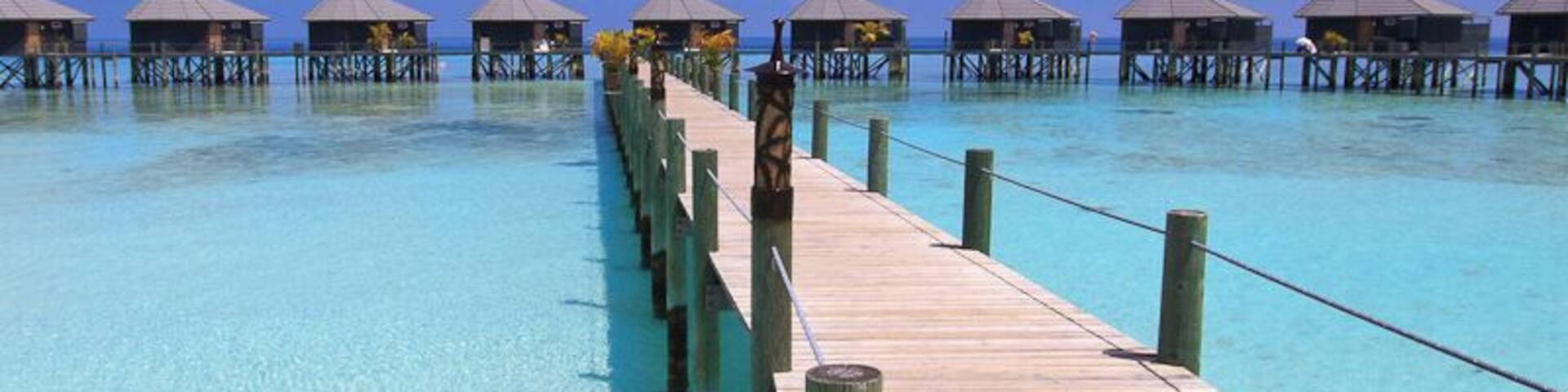 The watervillas on Komandoo Island Resort.
That's the tiny little island we lived and worked for two years. 15 Watervillas have been built over the water.
If you like to read, what we did on a day off on this little gem: http://www.swissnomads.com/2013/08/day-off-komandoo-island-resort-maldives/