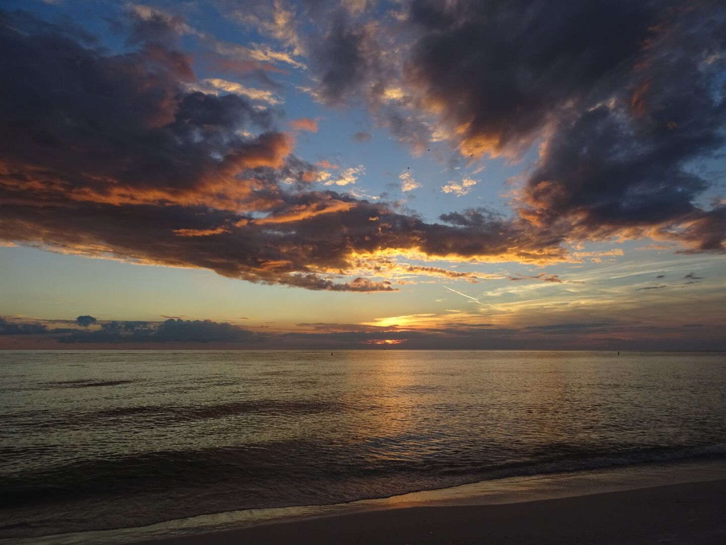 Sunset over the Gulf of Mexico on Longboat Key. 

This beach is very clean and not too crowded because the public accesses are off the main road, back into a neighborhood. 
