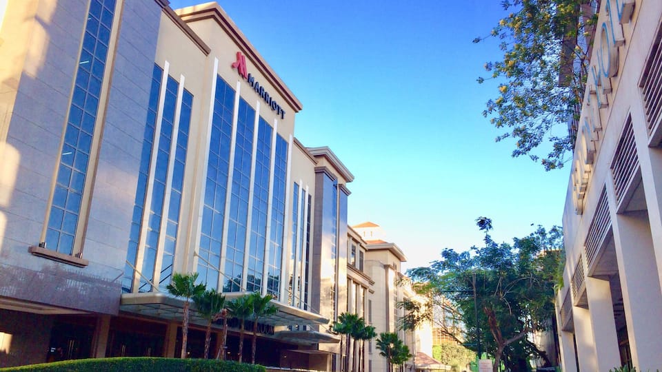 The Manila Marriott Hotel welcomes you to the Philippines with contemporary elegance, world-class service and an unparalleled location. You'll find our hotel within Resorts World, with its outstanding shopping, dining and entertainment; the 18-hole Villamor golf course is next door, and Manila Ninoy Aquino International Airport is moments away. Intuitively appointed rooms and suites are designed with your comfort in mind and feature deluxe bedding, marble bathrooms, flat-screen TVs and modern technology. Reserve a suite in our new West Wing for a truly memorable experience. Our hotel offers many varied dining options, including a steakhouse and an all-day buffet. Enjoy a workout in the gym or a massage at Quan Spa. Those planning events in Manila can make use of our expansive venue spaces, including the magnificent Grand Ballroom, which seats 3,800. Enjoy your free time by visiting one of the nearby malls and casinos, as well as Manila Ocean Park. We look forward to seeing you at the Manila Marriott Hotel.