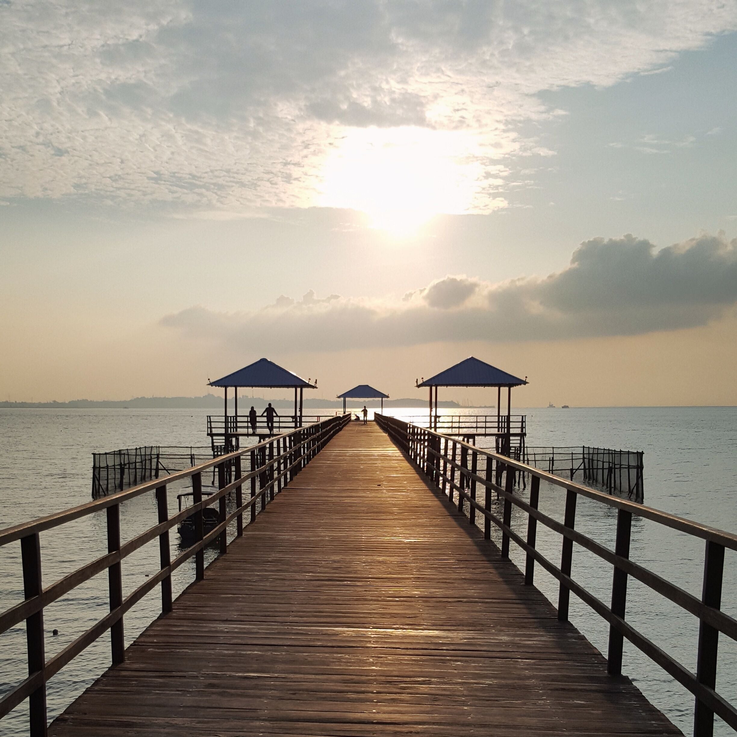 Symmetrical jetty leads out from the resort.