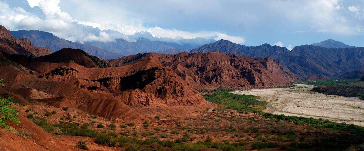 A rugged mountainous landscape with a winding river.