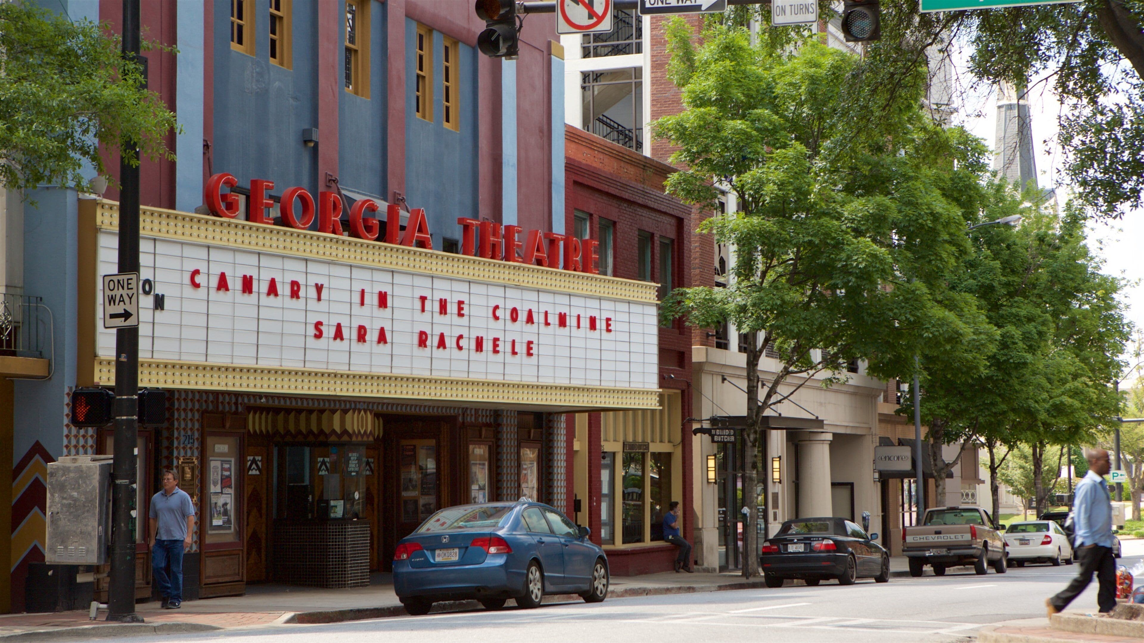 The Georgia Theatre with a marquee advertising "Carhart in the Coal Mine" and "Sara Rachelle."