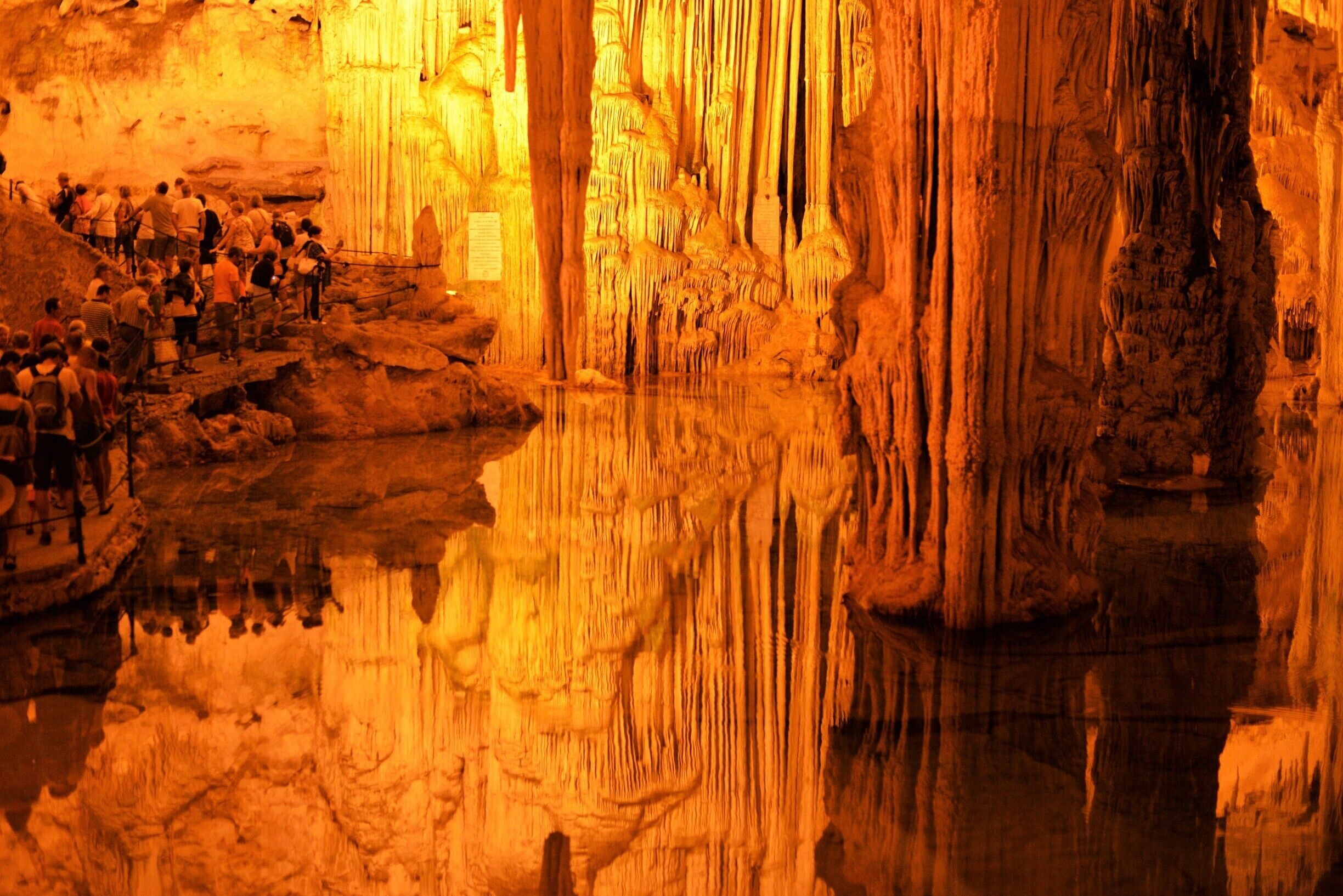 This Cave is  set in Capo Caccia, a tall promontory with a military lighthouse; it's smaller  than other sardinian caves,  but quite scenic and very famous . If you have good legs you can reach it by going down the  600 and some more steps of "the Roebuck stairs".It  follows the rocky contour of Capo Caccia ,offering a beautiful view on the sea, but remember that there is a way up too.. ;) Or you can hop on a boat, and it will be cheaper if you do so  from Cala Dragunera, rather than from Alghero..