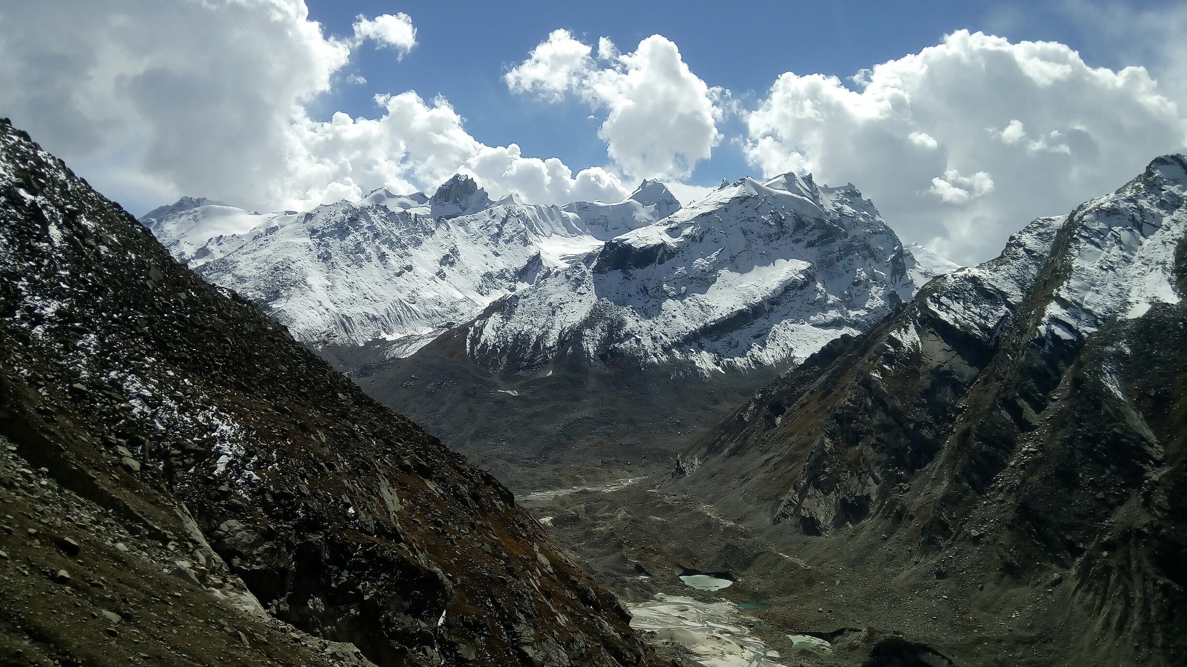 An astonishing view of ground water  snow covered mountains and sky